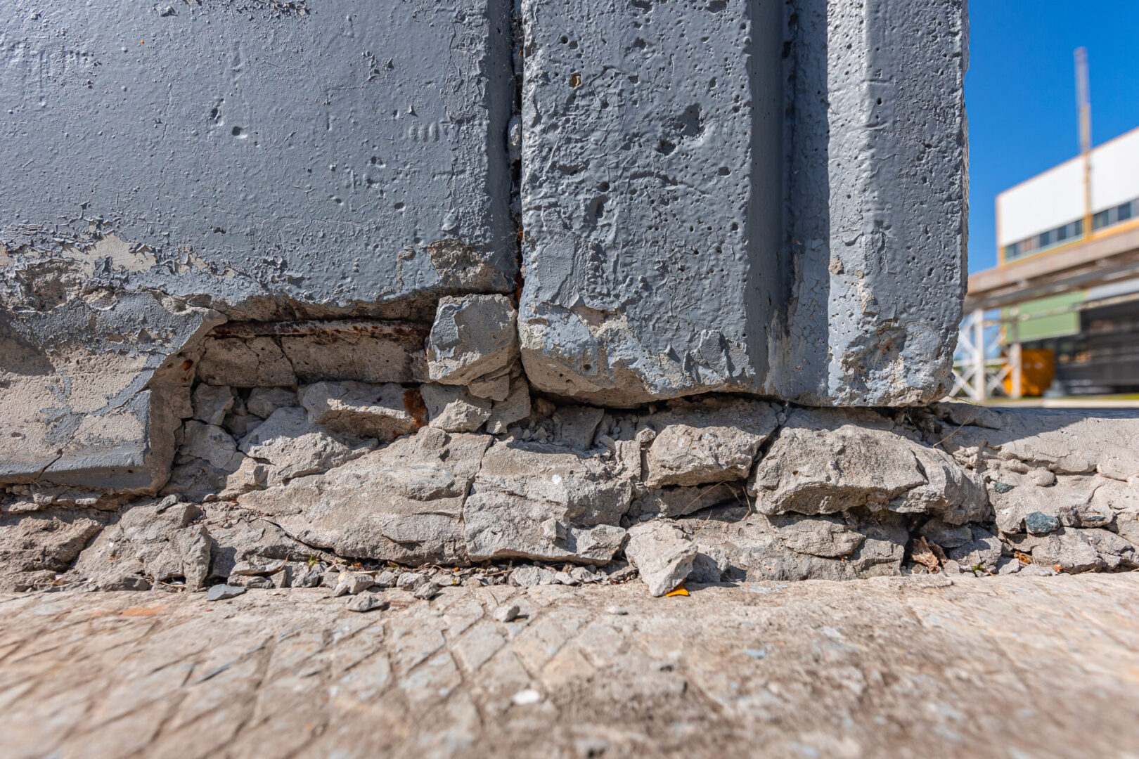 A close up of the side of a building with cracks