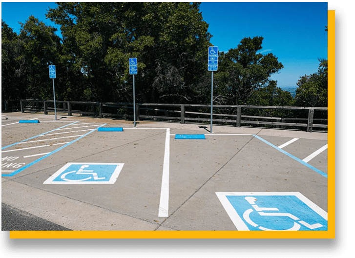 A parking lot with handicapped signs painted on it.